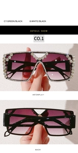 Macro shot of oversized square sunglasses with sparkling rhinestones and purple gradient lens