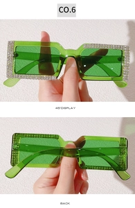 Detail view of green rectangular sunglasses with sparkling crystal diamond-encrusted frames