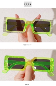 Detail of neon green rhinestone sunglasses with silver crystals and 45-degree view