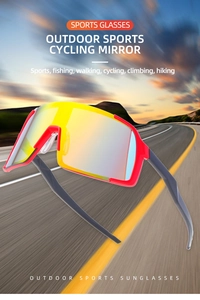 Detail of red cycling sunglasses with orange mirror lens on a blurred road background