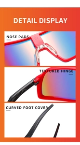 Detail view of red cycling glasses featuring adjustable nose pads and reinforced hinges