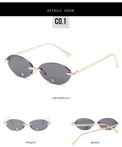 Details von randloser Tränen-Sonnenbrille mit goldener Fassung und Strasssteinen