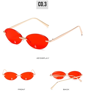 Detailansichten der schmalen randlosen Sonnenbrille mit roten Gläsern und Kristallen