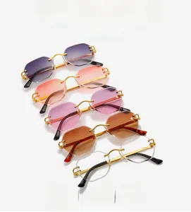 Close-up of rimless octagon sunglasses with colorful gradient lenses and gold metal temples
