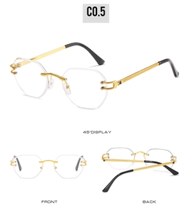 Detail view of octagon rimless sunglasses with gold C-decor hinges and textured temples