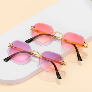 Fashionable rimless octagonal sunglasses with gradient lenses and gold metal frames