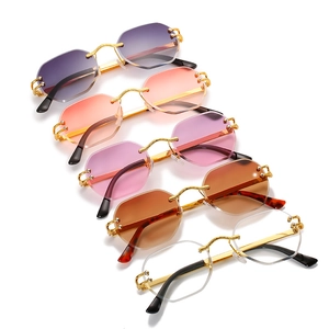 Frameless octagonal sunglasses with gradient ocean lenses and gold metal frames