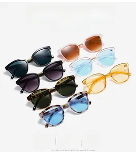 Flat lay of vintage oversized sunglasses in assorted frame colors and gradient lenses