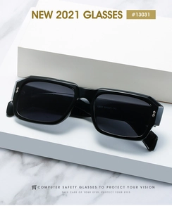 Detail view of rectangular black eyewear frame with H-shaped metal hinge decoration