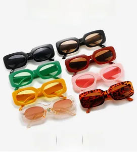 Flat lay of retro rectangle sunglasses in eight vibrant candy colors with thick frames