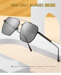 Close-up of double-bridge geometric sunglasses with gray lenses on an artistic stand