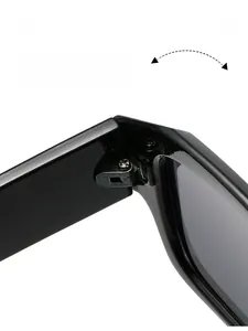 Macro view of durable metal hinge on black small polygon sunglasses for daily wear