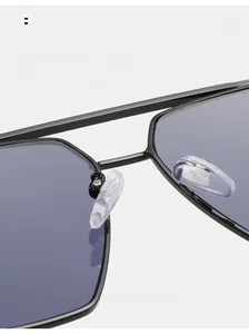 Close-up of comfortable transparent silicone nose pads on black metal sunglasses frame