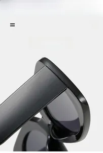 Detail of lightweight black flexible frame hinges on trendy square sunglasses