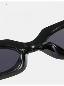 Macro detail of ergonomic black glossy sunglasses with integrated nose pads for comfort