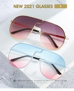 Gros plan de lunettes de soleil sans monture oversize avec verres dégradés sur pierre