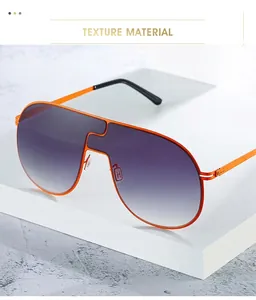 Détail de lunettes de soleil sans monture avec cadre orange et verres violets dégradés