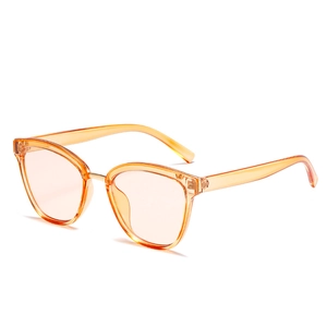 Retro transparent orange sunglasses with gold metal bridge and light amber lenses
