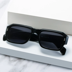 Retro small frame polygon sunglasses with black lenses and silver rivet accents