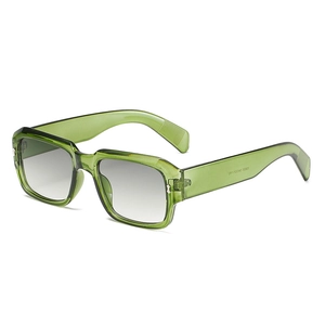 Retro translucent green polygonal sunglasses with gradient lenses in a 45-degree side view