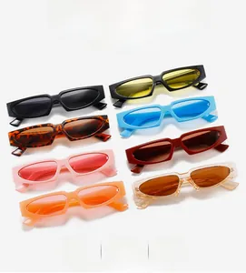 Flat lay of retro rectangle sunglasses in eight diverse colors on white background