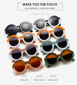 Detail showing various colors of large round frame sunglasses with a trendy two-tone design