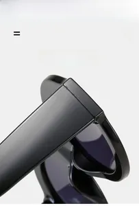 Detail shot of sturdy hinges and polished black frame on vintage oversized sunglasses