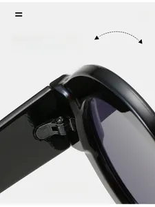 Close-up of durable silver metal hinge on oversized retro round frame sunglasses