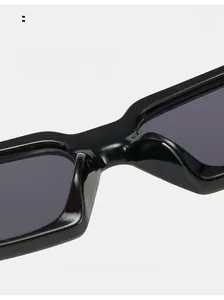 Close-up of comfortable integrated nose pads on black narrow rectangular sunglasses