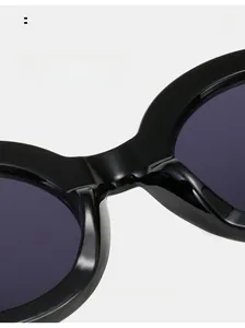 Detail of ergonomic integrated nose pads on black glossy oversized retro sunglasses