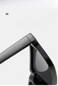 Detail view of durable metal hinge and sleek black frame on rectangular sunglasses