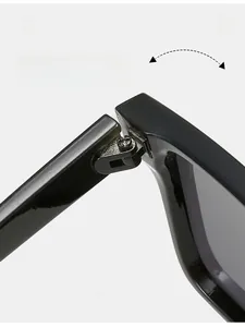 Detail of durable texture hinge with metal screws on rectangular black sunglasses