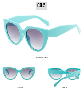Detailed views of cyan cat eye sunglasses with purple gradient lenses and diamond temples