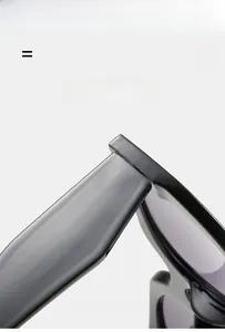 Close-up of flexible hinges and glossy black frame of lightweight fashion sunglasses