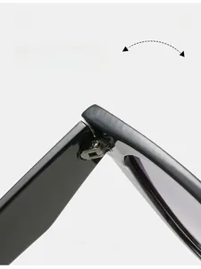 Detail view of the durable silver metal hinge on high-quality black sunglasses frames