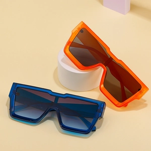 Modern square oversized sunglasses in bright orange and transparent blue with gradient lenses