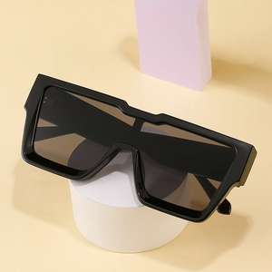 Fashionable oversized square black sunglasses for women with thick frames and dark lenses