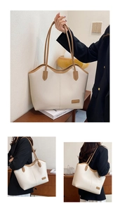 Detailed macro of cream lychee texture leather tote bag with brown edge painting and logo