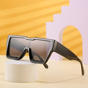 Modern square oversized black frame sunglasses with flat top design on creative stand