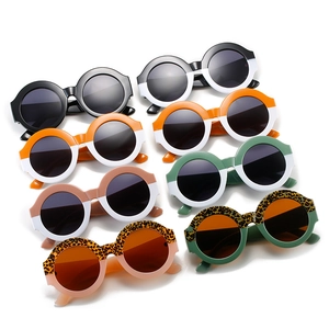 Eight pairs of children's vintage round sunglasses in various bi-color and leopard patterns