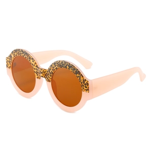Retro round oversized sunglasses with peach pink and leopard print frames for women
