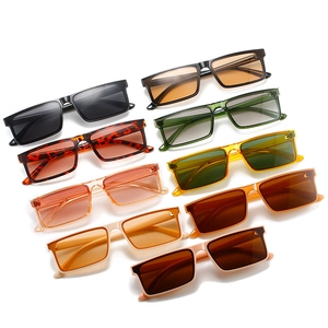 Multiple colors of retro rectangular sunglasses in a flat lay display on white background