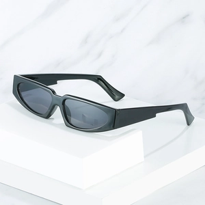 Retro thick frame oval sunglasses with dark gray lenses on marble textured background