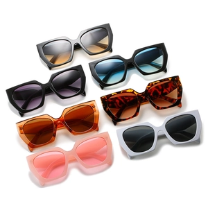 Collection of oversized geometric sunglasses with wide temples in multiple vibrant colors