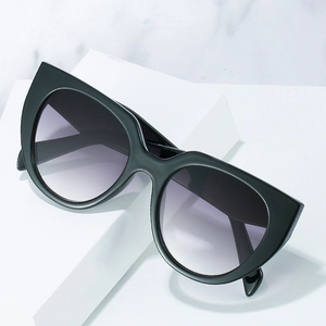 Fashionable cat eye sunglasses with purple gradient lenses and black geometric temples