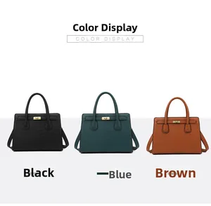 Detailed view of crocodile pattern handbags in black, blue and brown with gold twist locks