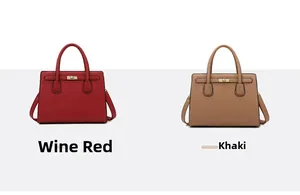 Detail of burgundy and khaki croc-patterned tote bags with metallic twist-lock closure