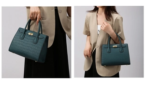 Detail of dark green crocodile pattern handbag with gold twist lock and dual handles