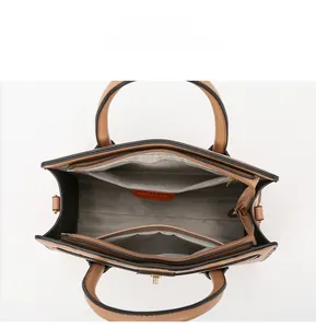 Top view of brown stone-pattern tote bag showing multi-compartment interior and grey lining