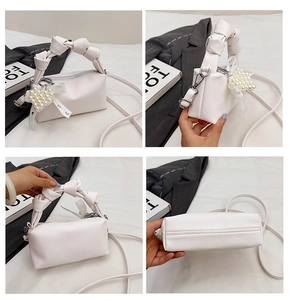 Four views of a white litchi pattern handbag with knot handle and pearl heart charm
